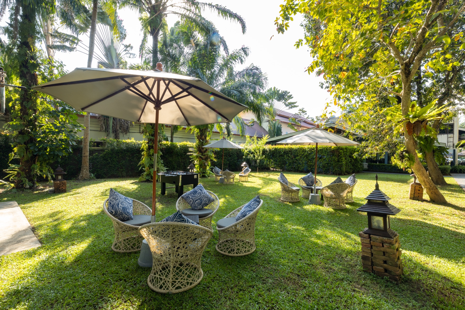 Parasol and chairs on the lawn